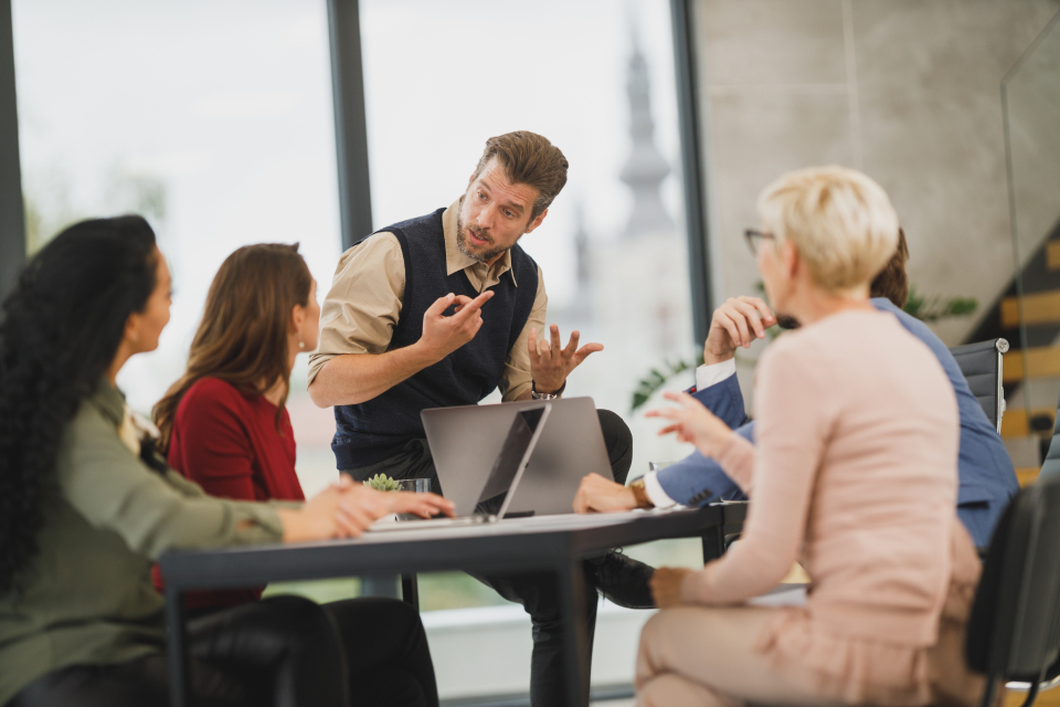 Employees collaborating during a corporate language training session